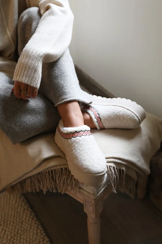 Slippers for indoor rest -CHERRY FLATFORM AZTEC DETAIL LOW ANKLE SLIPPER BOOTS IN CREAM SHEARLING