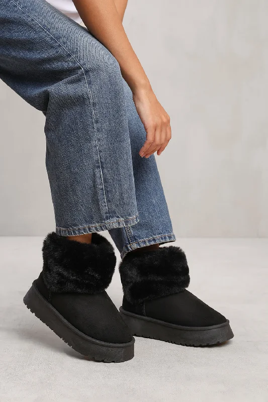 Slippers with worn fabric -CLARA ANKLE SLIPPER BOOT WITH FAUX FUR LINING AND TRIM IN BLACK